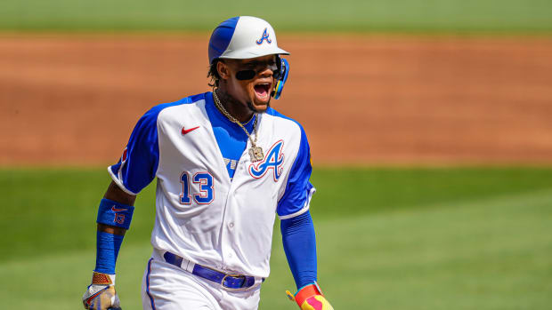 Jun 10, 2023; Cumberland, Georgia, USA; Atlanta Braves right fielder Ronald Acuna Jr. (13) reacts as he scores a run against the Washington Nationals during the first inning at Truist Park. Mandatory Credit: Dale Zanine-USA TODAY Sports